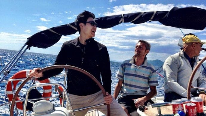 Zwee takes the helm of a private yacht while on an overseas trip. He sure knows how to work hard and play hard. Photo courtesy of Zwee 