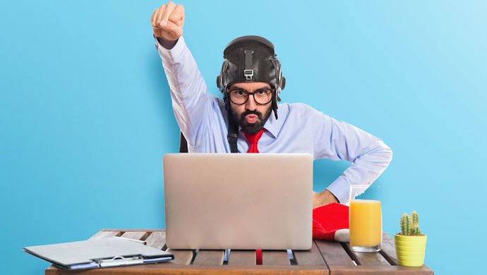 40989416 - businessman in his office with pilot hat