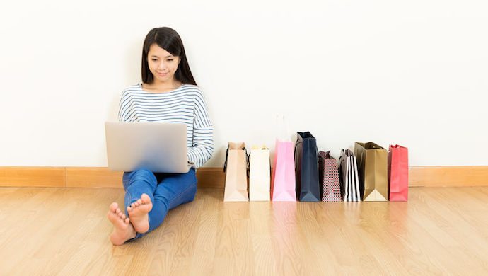 27506459 - asia woman online shopping at home