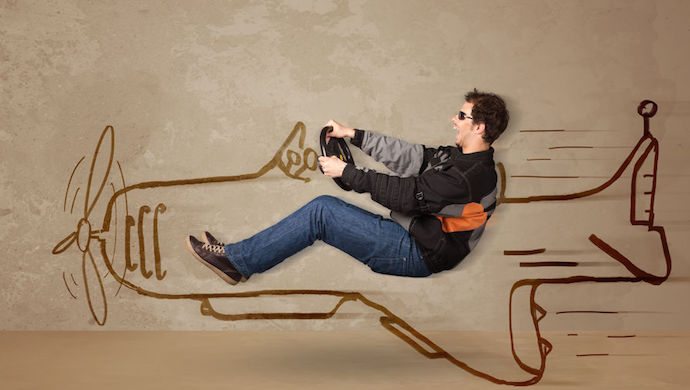 40043721 - funny pilot driving a hand drawn airplane on the wall concept